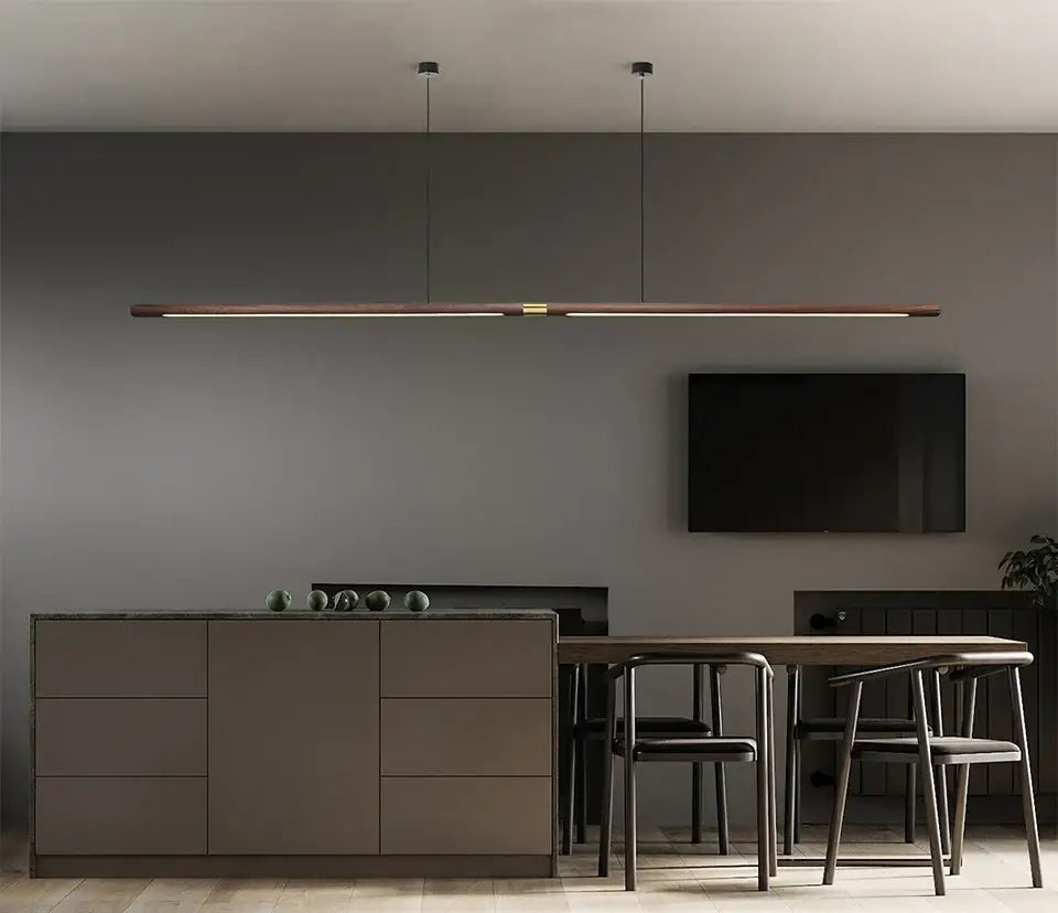 Luxury LED solid wood pendant light over a modern dining table in a stylish kitchen interior.