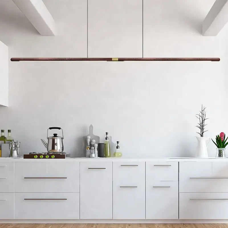 Luxury LED solid wood pendant light in a modern kitchen, showcasing Nordic black walnut design and energy-efficient lighting.