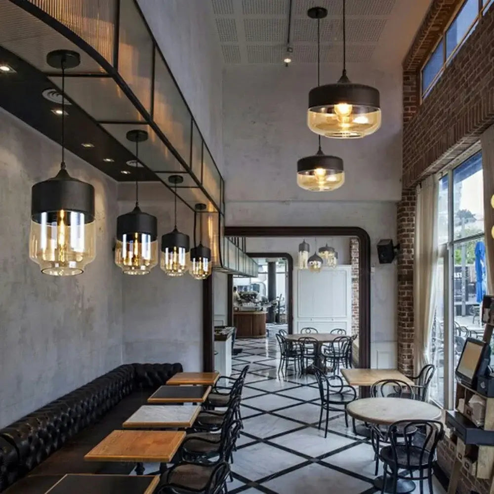 Modern cafe interior showcasing Nordic LED glass pendant lights and stylish dining furniture.