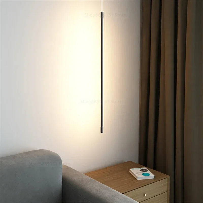 Nordic modern pendant lights hanging over a sofa, featuring a minimalist design, perfect for home decor.