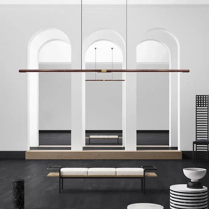 Luxury LED solid wood pendant light in a modern dining room with minimalist decor.
