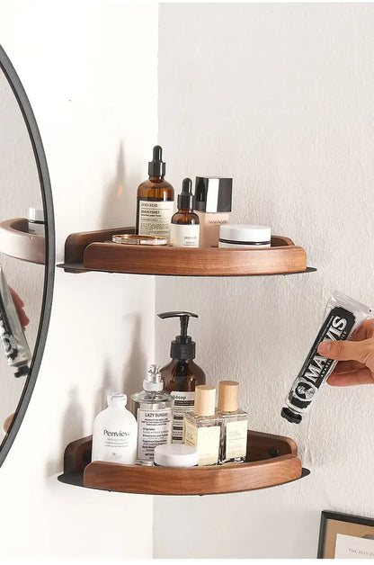 Black and white wall mounted bathroom shelves displaying skincare products in a modern bathroom setting.
