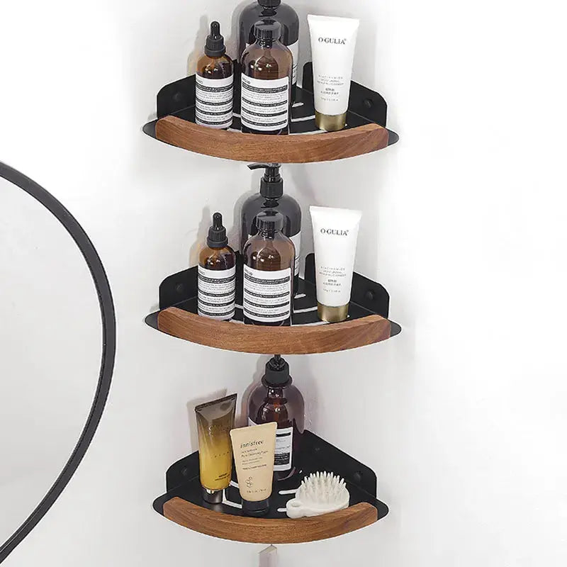 Black and white wall mounted bathroom shelves displaying various beauty products in a bathroom setting.