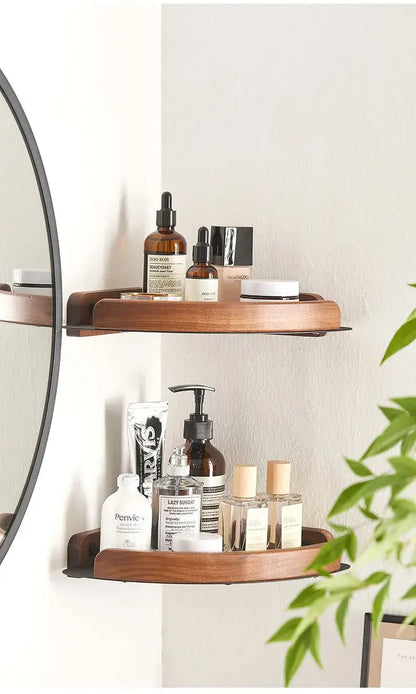 Black and white wall mounted bathroom shelves displaying various beauty products.