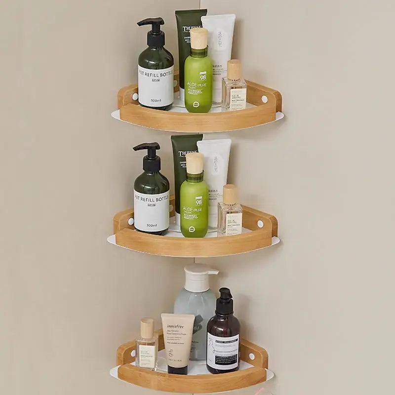 Black and white wall mounted bathroom shelves displaying various skincare and refill bottles.