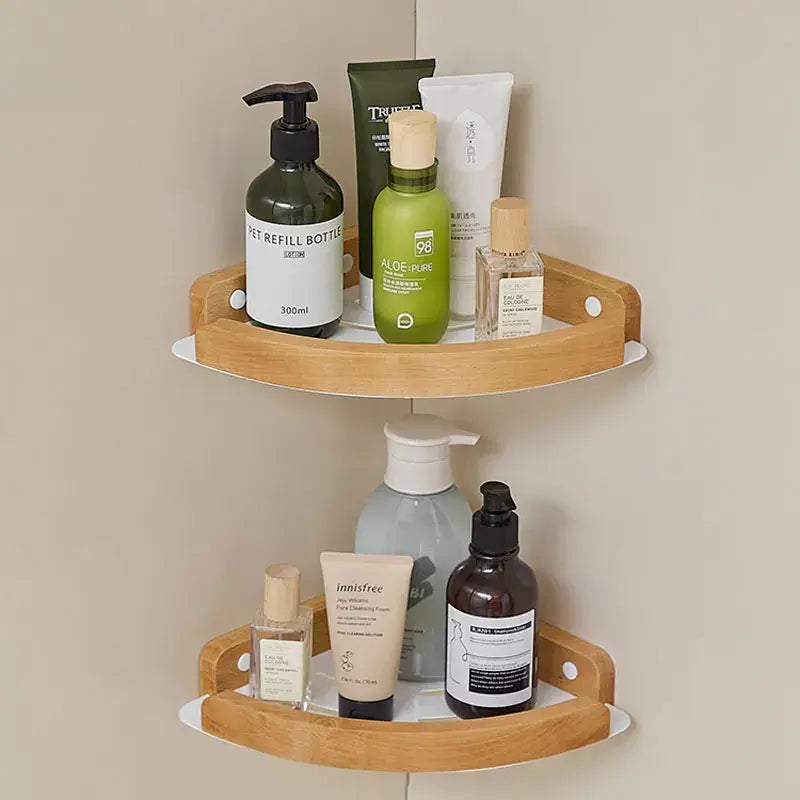 Black and white wall mounted bathroom shelves with skincare and beauty products displayed elegantly.