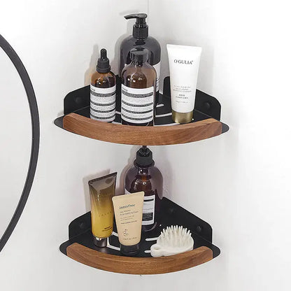 Black and white wall mounted bathroom shelves showcasing toiletries and beauty products in a stylish corner installation.
