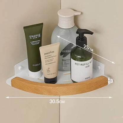 Black and white wall mounted bathroom shelves holding toiletries and beauty products.