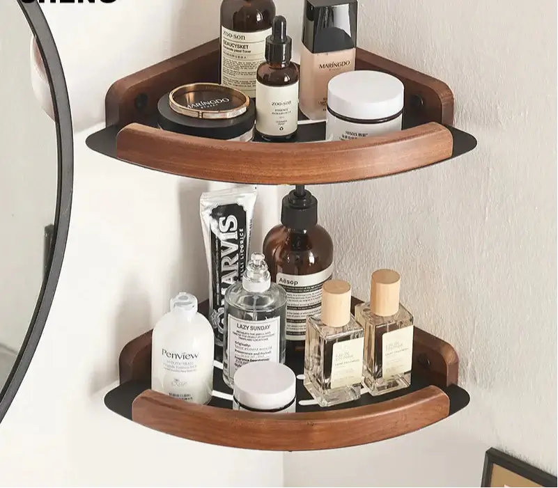 Black and white wall mounted bathroom shelves holding various beauty products and toiletries.
