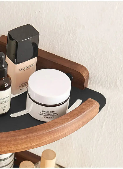 Black and white wall mounted bathroom shelves showcasing beauty products and elegant design.