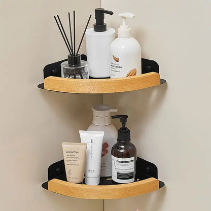 Black and white wall mounted bathroom shelves displaying various toiletries and essential oils.