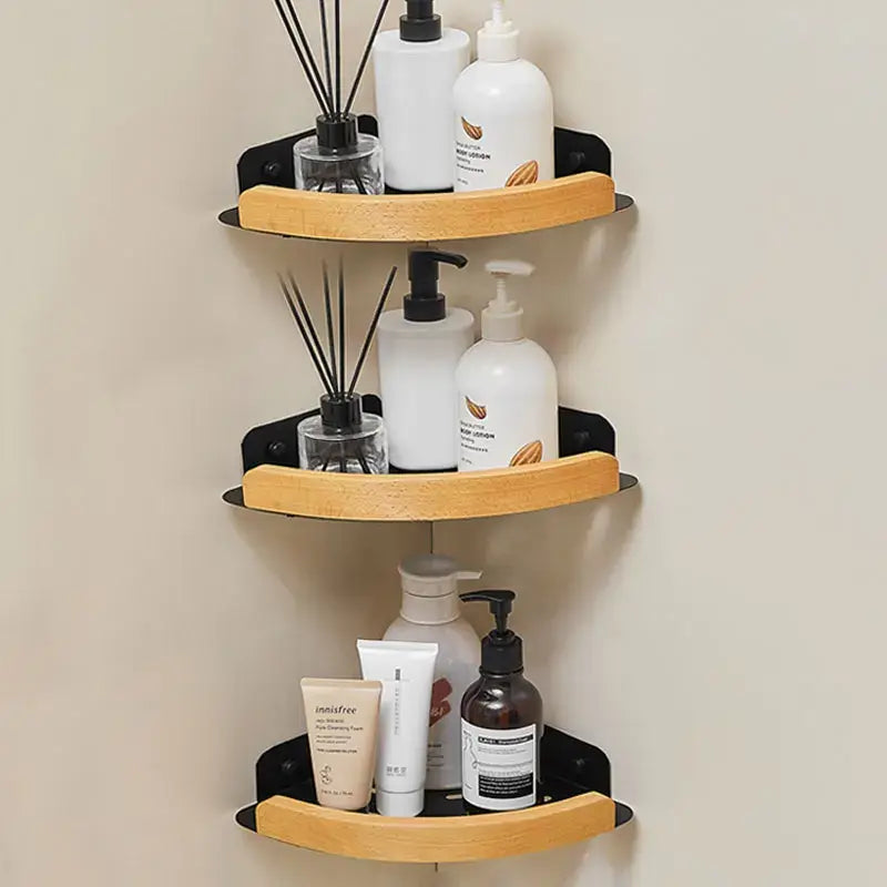 Black and white wall mounted bathroom shelves with toiletries and decor on display.
