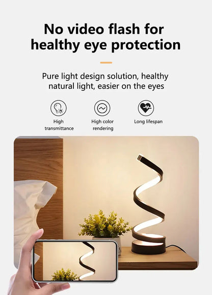 Dimmable spiral LED night light illuminating a cozy bedside table with healthy eye protection features.