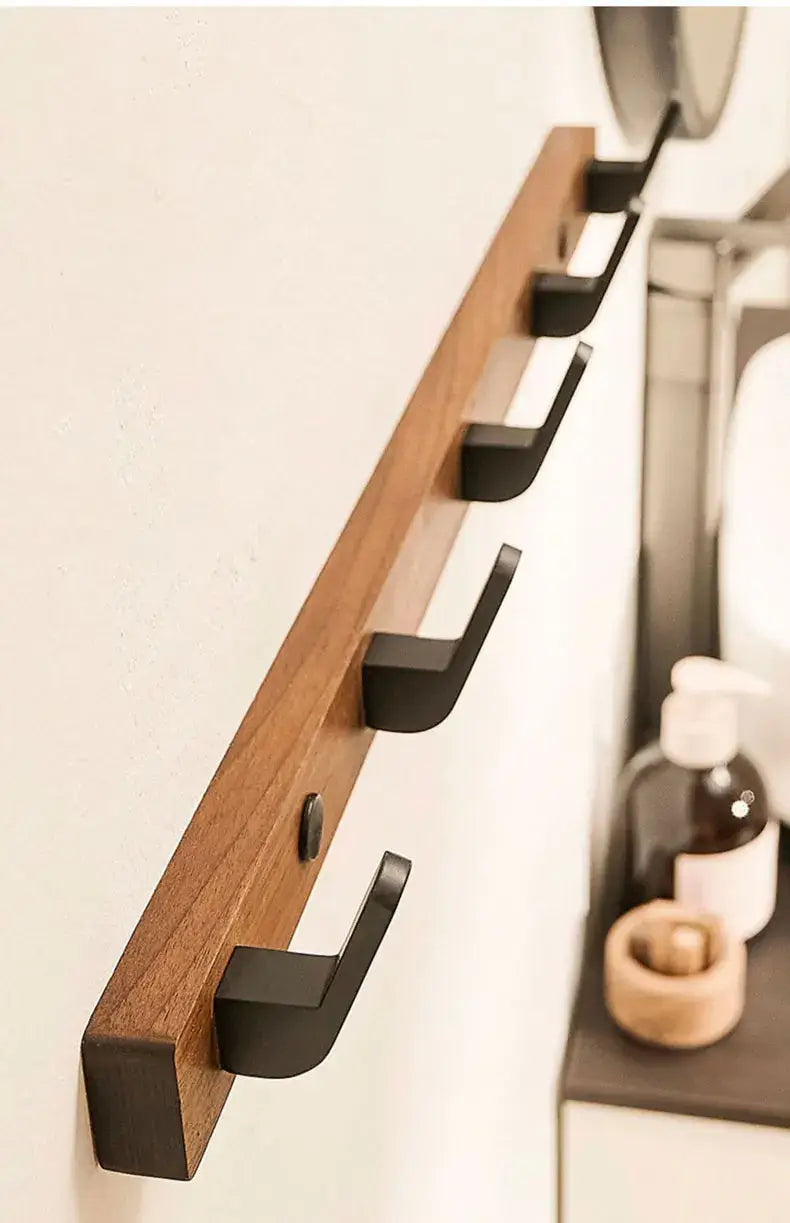 Wood Black Hook from Housite, stylish space-saving solution for towels and coats in modern interiors.