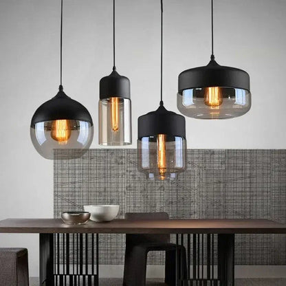 Modern Nordic LED pendant lights in a stylish dining room setting with wooden table and artistic wall.