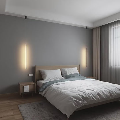 Nordic modern pendant lights illuminating a minimalist bedroom with a stylish bed and elegant decor.