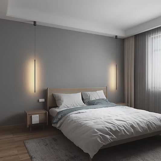 Nordic modern pendant lights illuminating a minimalist bedroom with a stylish bed and elegant decor.