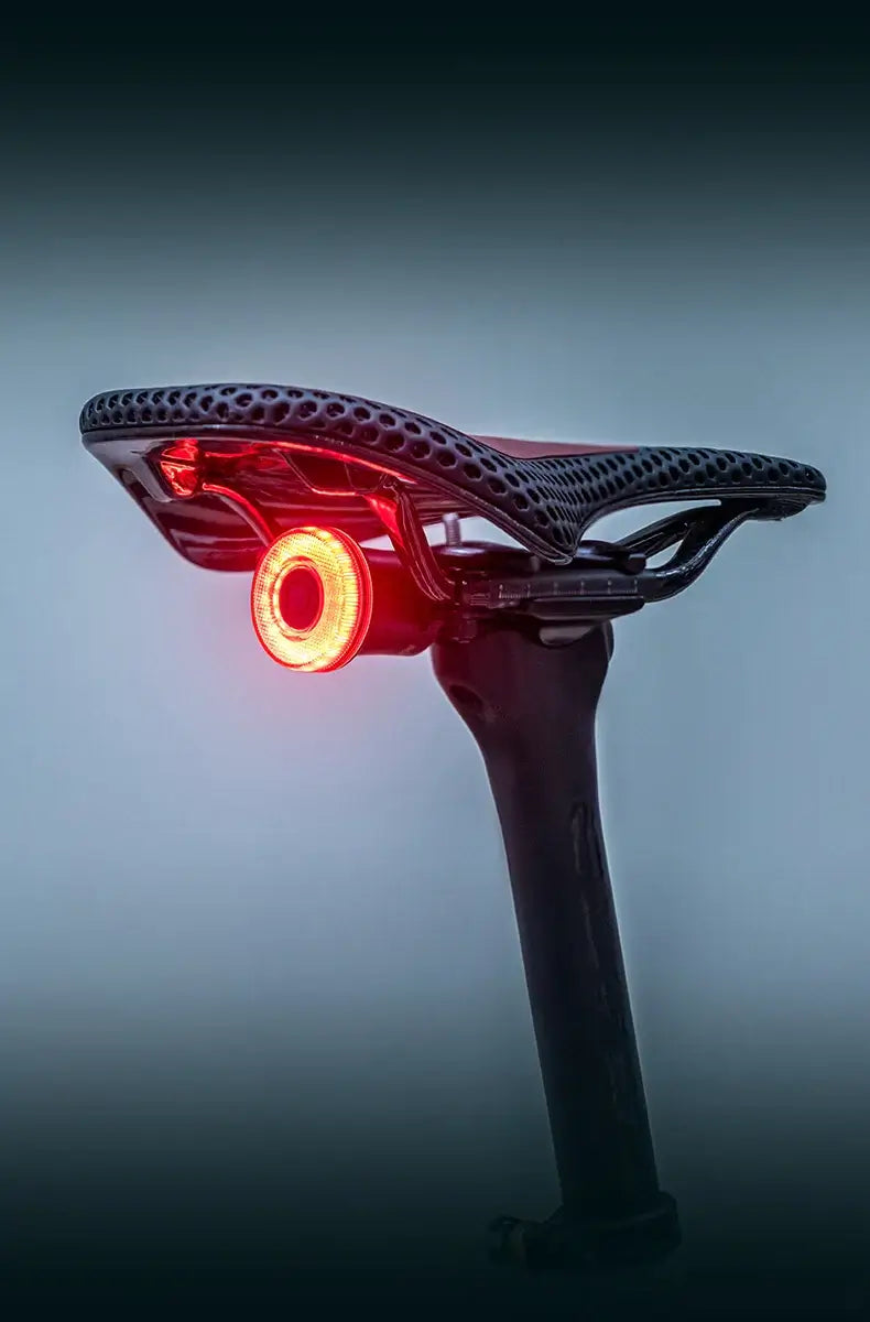 Smart Bike Tail Light – USB-C Rechargeable LED Rear Bicycle Light | IPX6 Waterproof Safety Light for Night Riding & Cycling on bike saddle.