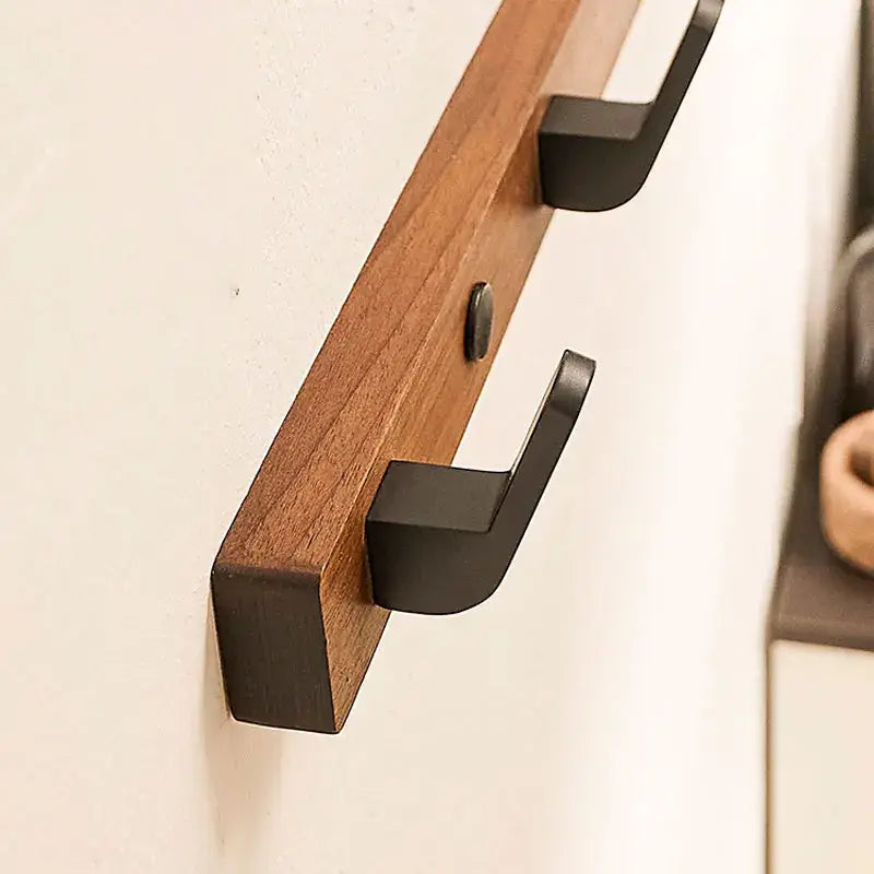 Wood Black Hook showcases sleek design for space-saving towel and coat storage in modern interiors by Housite.