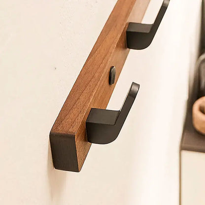 Wood Black Hook showcases sleek design for space-saving towel and coat storage in modern interiors by Housite.