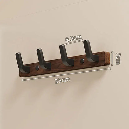 Wood black hook for towels and clothes, featuring four hooks and sleek design, perfect for modern interiors by Housite.